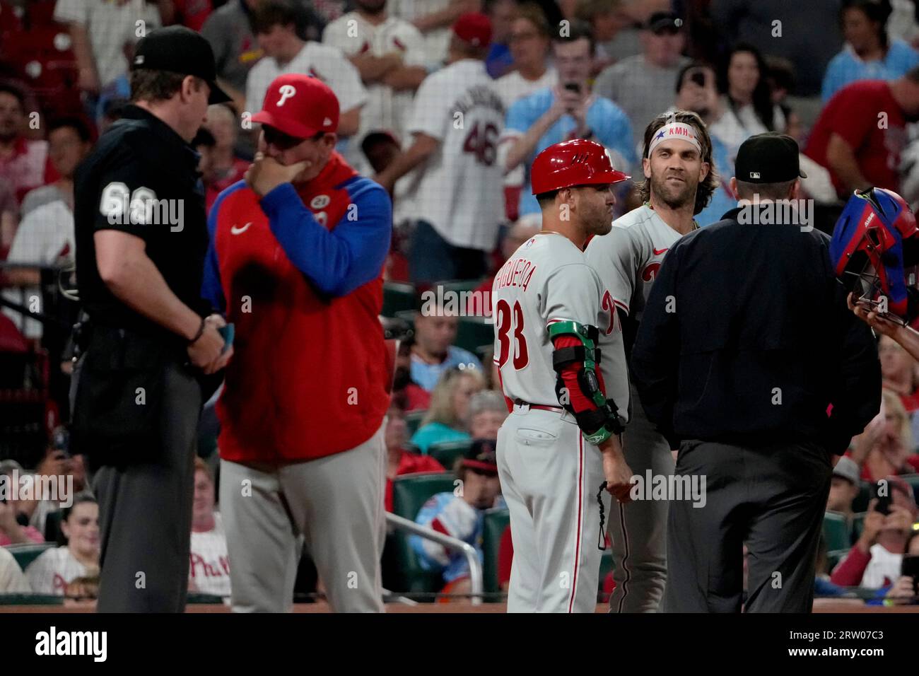 Philadelphia Phillies' Bryce Harper, second from right, yells in the