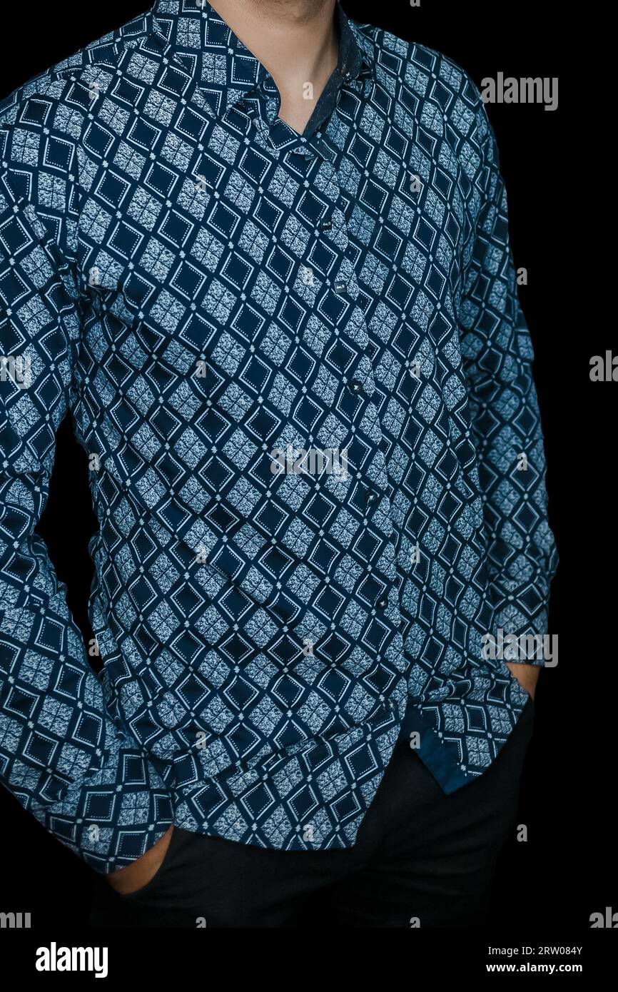 Men's abstract clothing style business fashion rhombus shirt blue pattern on dark background. Stock Photo