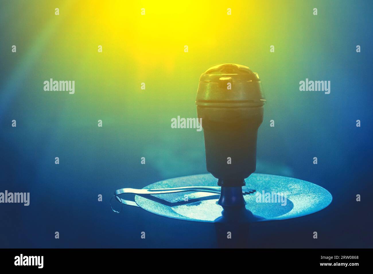 Hookah head bowl smoking object in blue glare light close-up Stock Photo -  Alamy