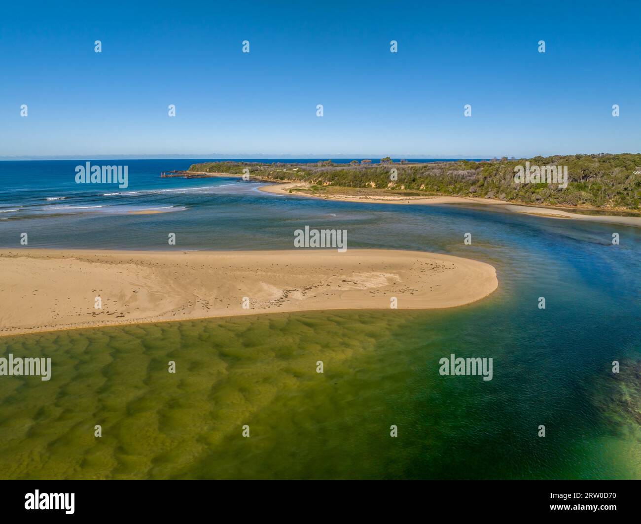 Blue sky daytime coast views over the sea and the Wallagaraugh River at Mallacoota, Victoria, Australia Stock Photo