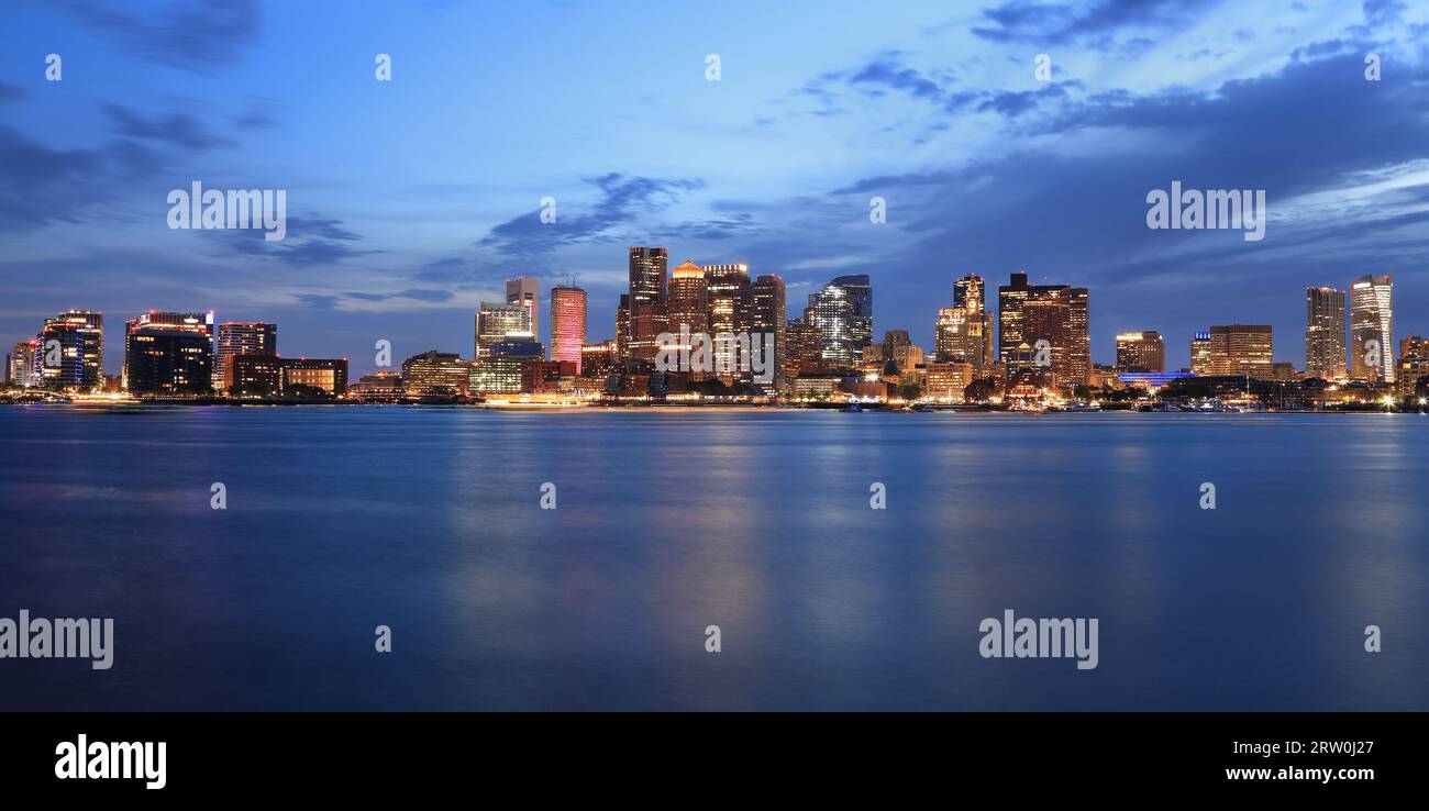 Boston skyline and harbor at dusk with Atlantic Ocean on the foreground, USA Stock Photo