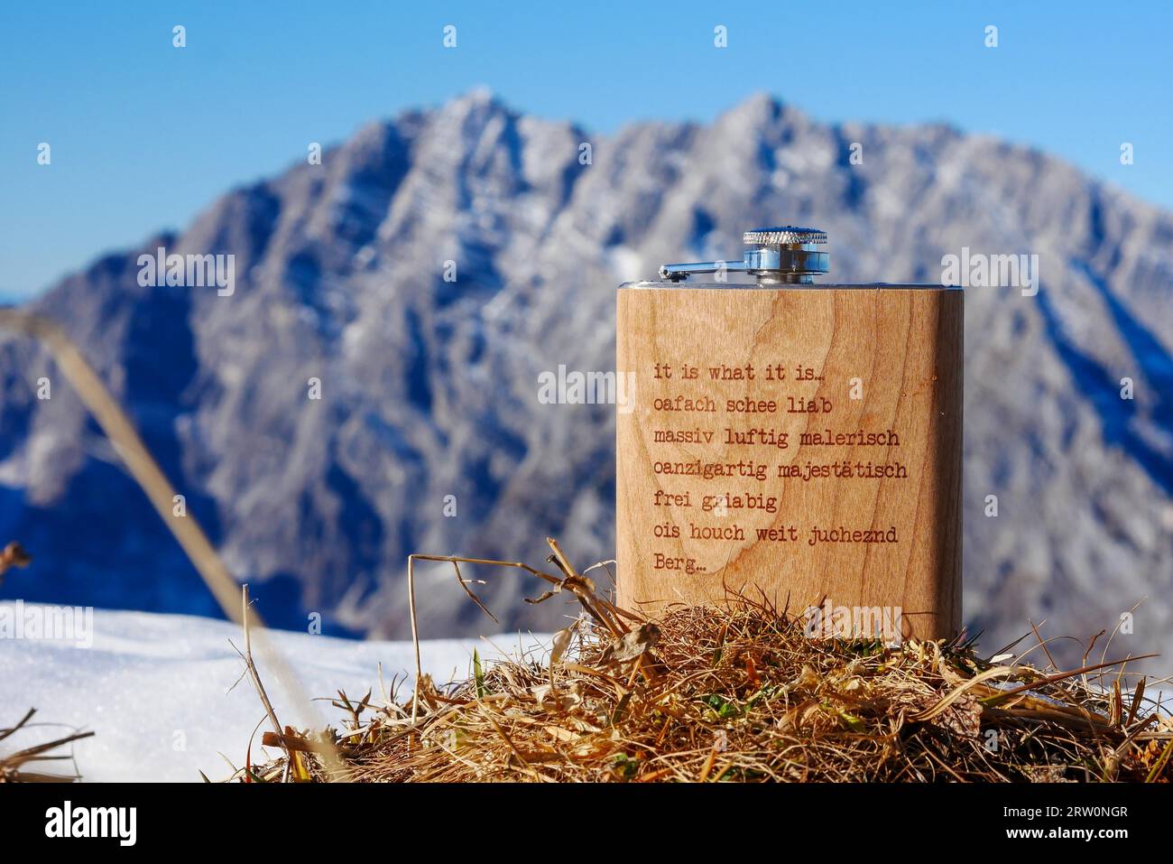 Summit schnapps with the Watzmann east face in late autumn as background, Berchtesgaden National Park, Bavaria, Germany, hip flask, schnapps Stock Photo