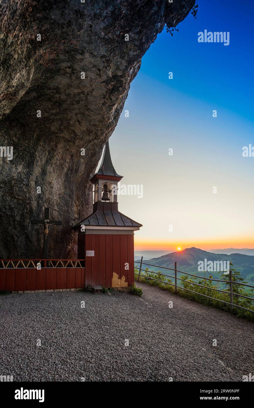 Chapel in rocks, Wildkirchli, sunrise, below Ebenalp, Weissbad, Alpstein, Canton Appenzell Innerrhoden, Switzerland Stock Photo