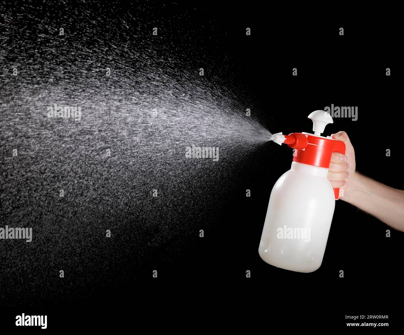 Liquid spraying from a pump sprayer Stock Photo Alamy