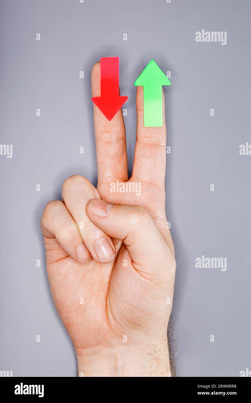 A hand with arrow stickers. Very short depth-of-field and ring flash lighting Stock Photo