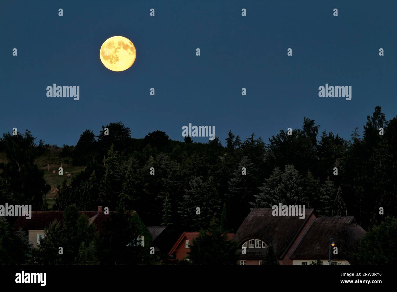 Full moon in the night sky over Alt Reddevitz Moenchgut, Island of ...