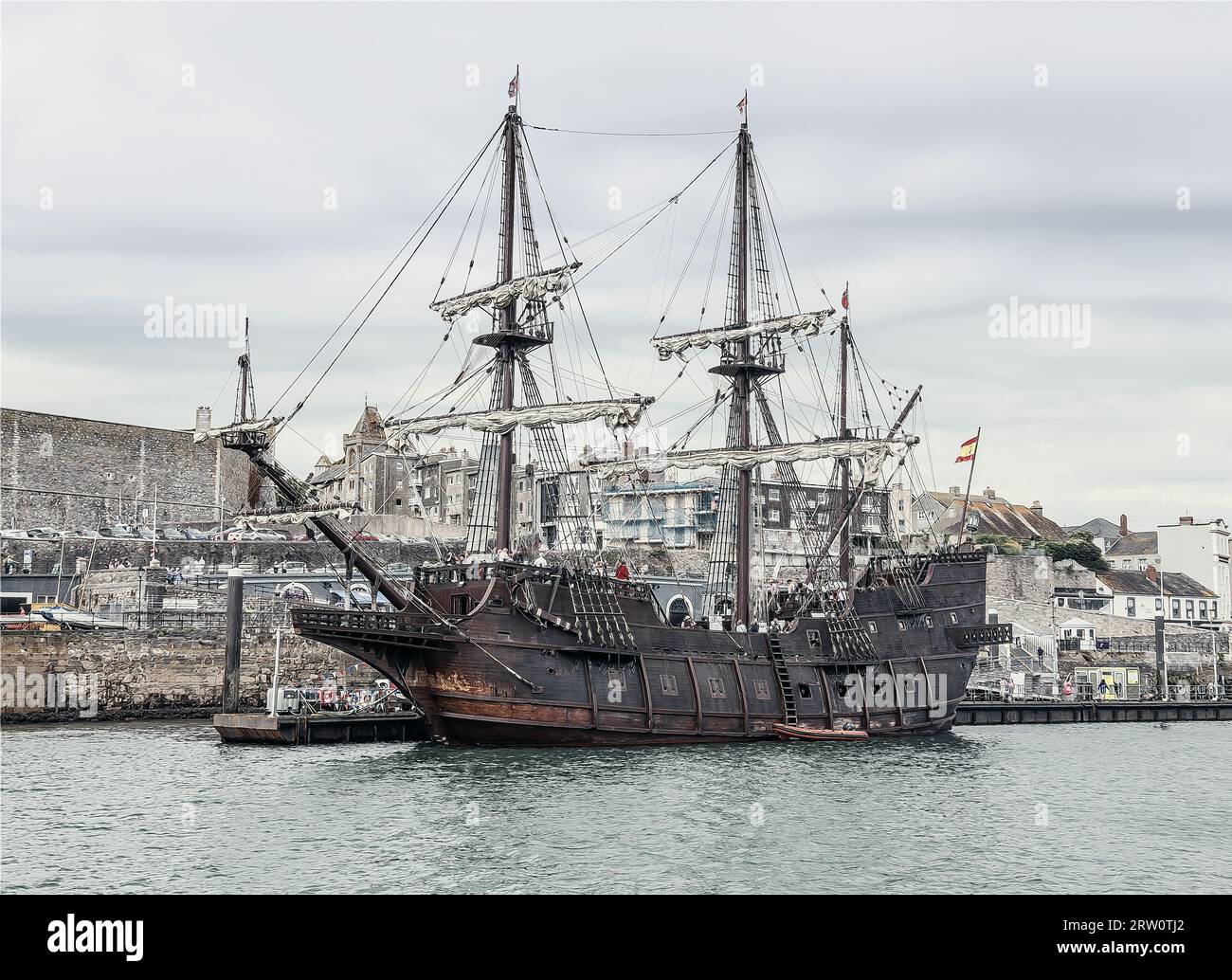 Phoro illustration of the El Galeon berthed at the Barbican Pontoon in Plymouth, with pale washed out colour. The full size replica of a 17th century Stock Photo