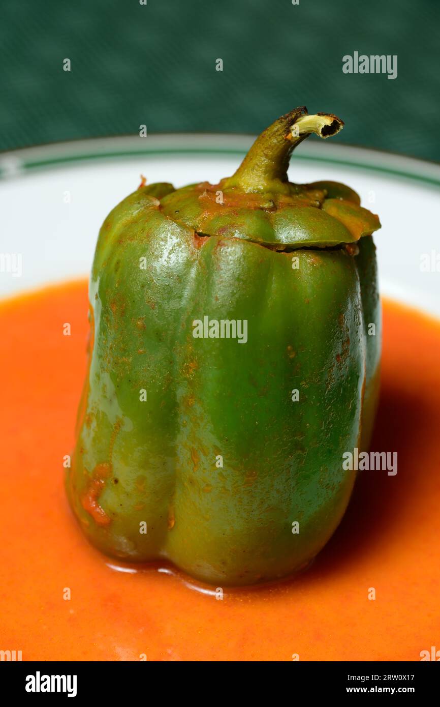 Stuffed Green Bell Pepper or Gefullte Paprika with Tomato Sauce Austrian Style Stock Photo