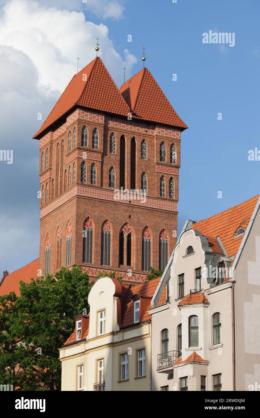 Church of St Jacob tower, medieval Gothic architecture, tenement houses, city of Torun, Poland Stock Photo