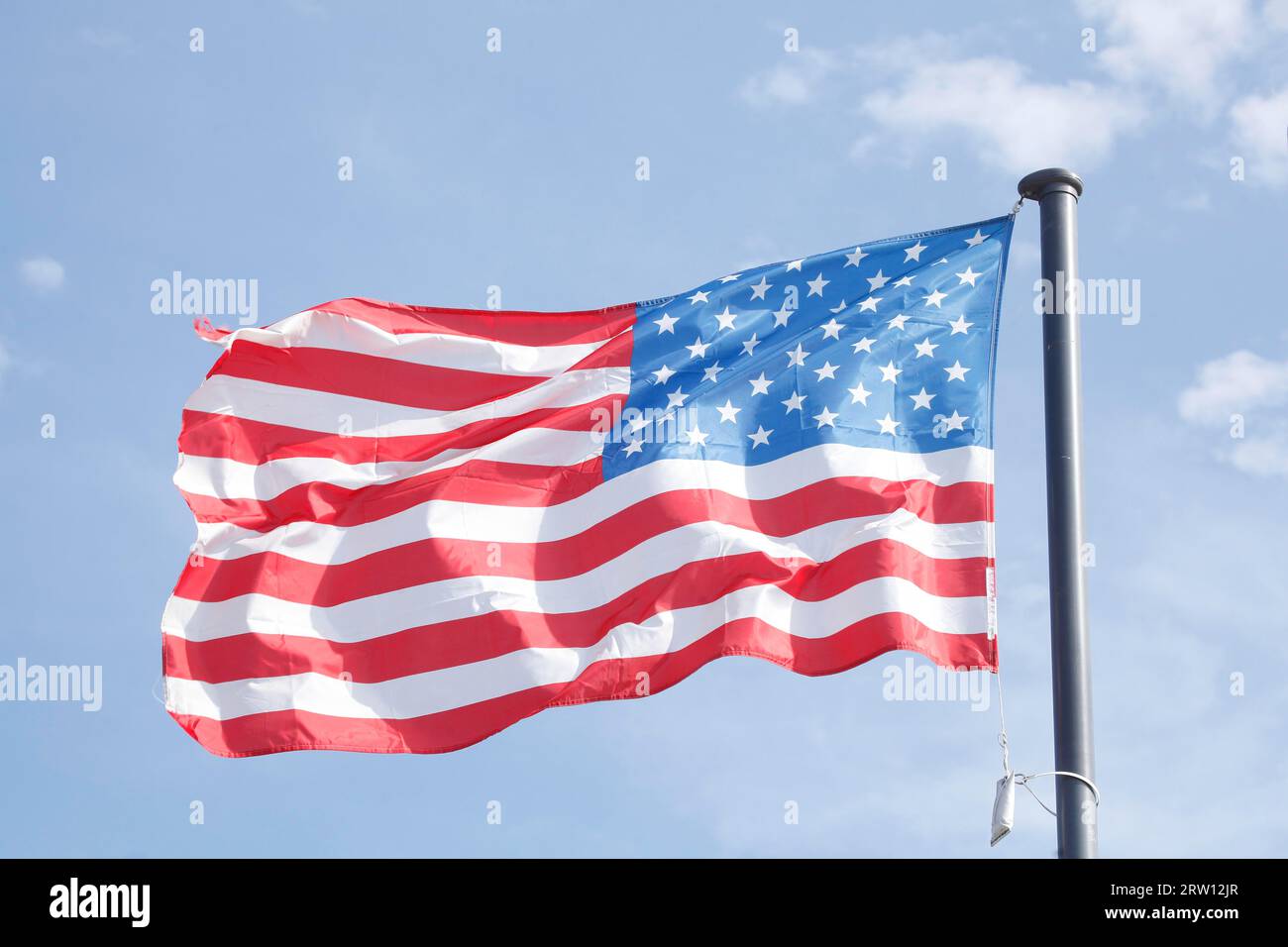 Flag of the USA waving in the wind, Blue sky, Germany Stock Photo
