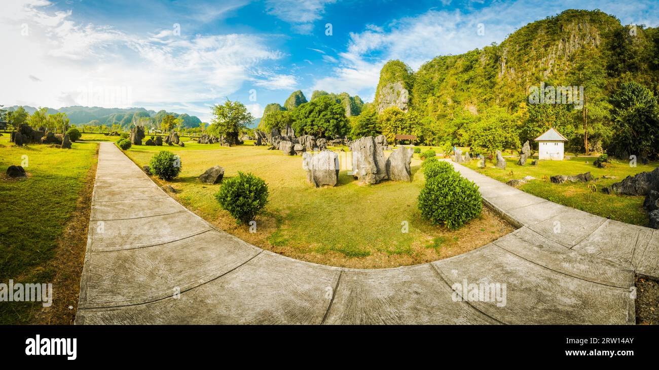 Photo of greenery of large garden with stone path and surrounding stones in Maros in southwestern Sulawesi in Indonesia Stock Photo