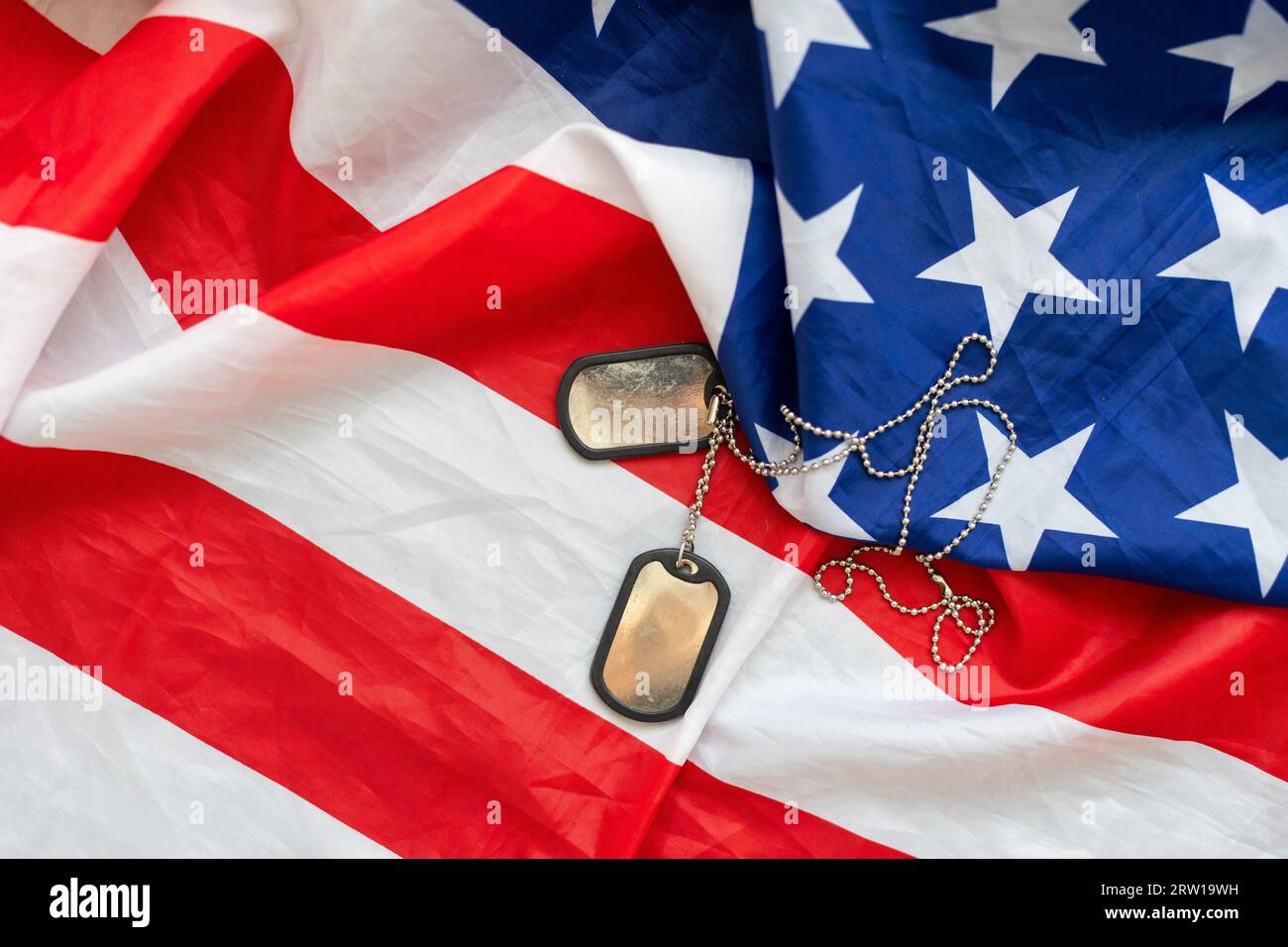 military dog tags on American flag with embroidered stars Stock Photo ...