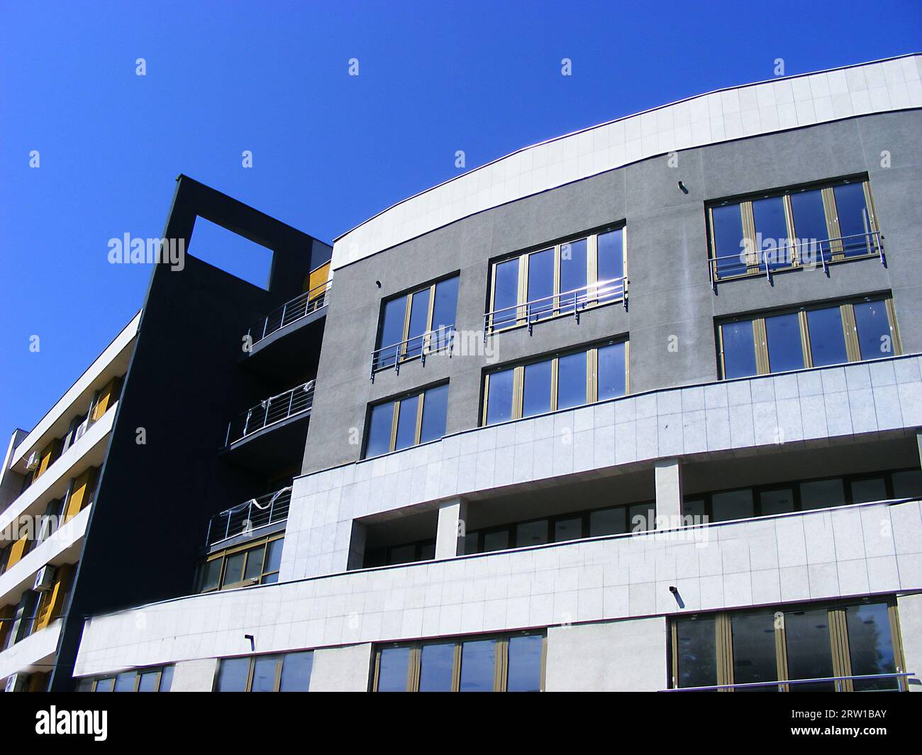 Modern design architecture in urban big city, combination of steel, bricks and glass elements Stock Photo