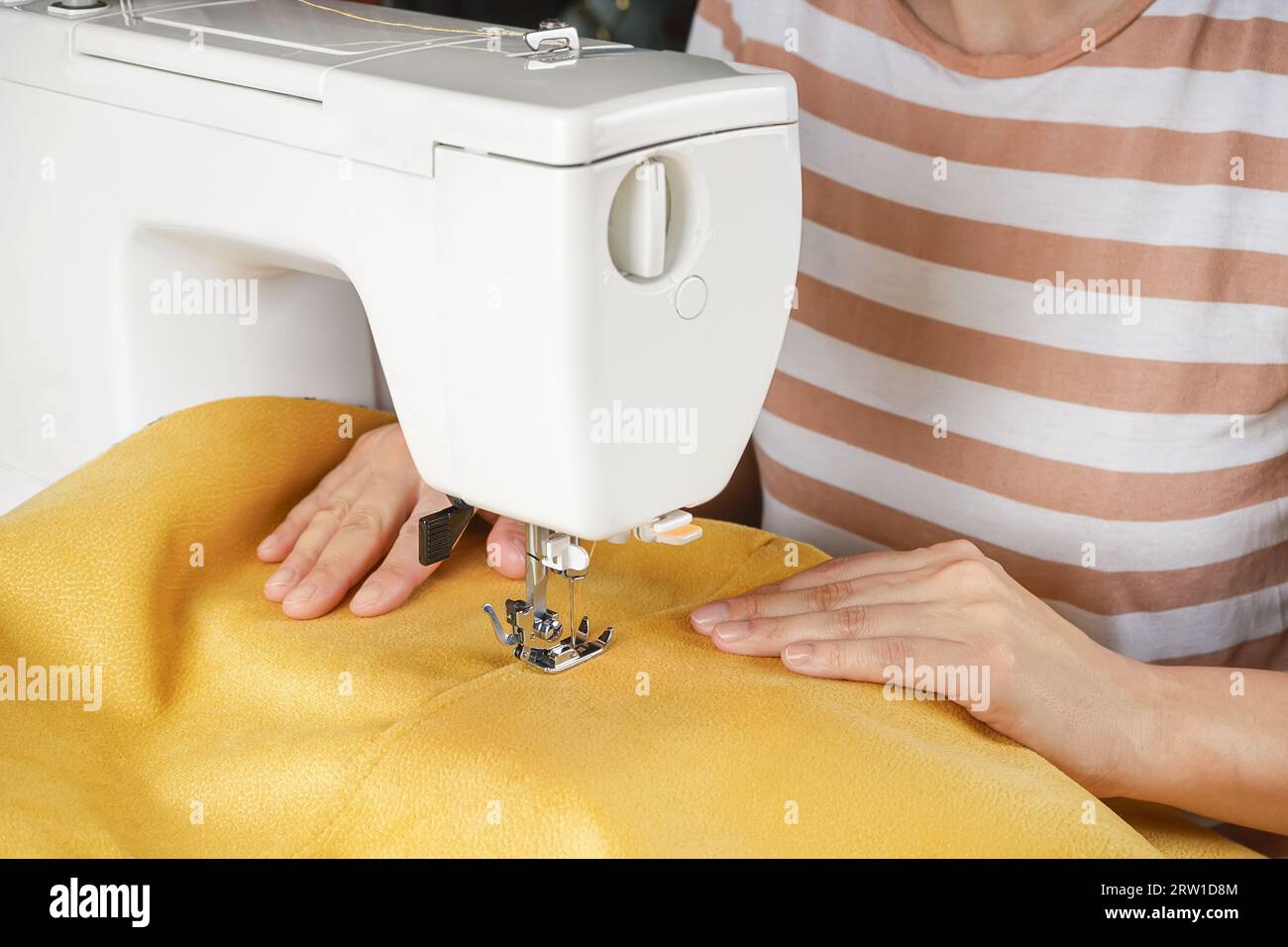 Premium Photo  Seamstress hands cut sewing machine thread, closeup
