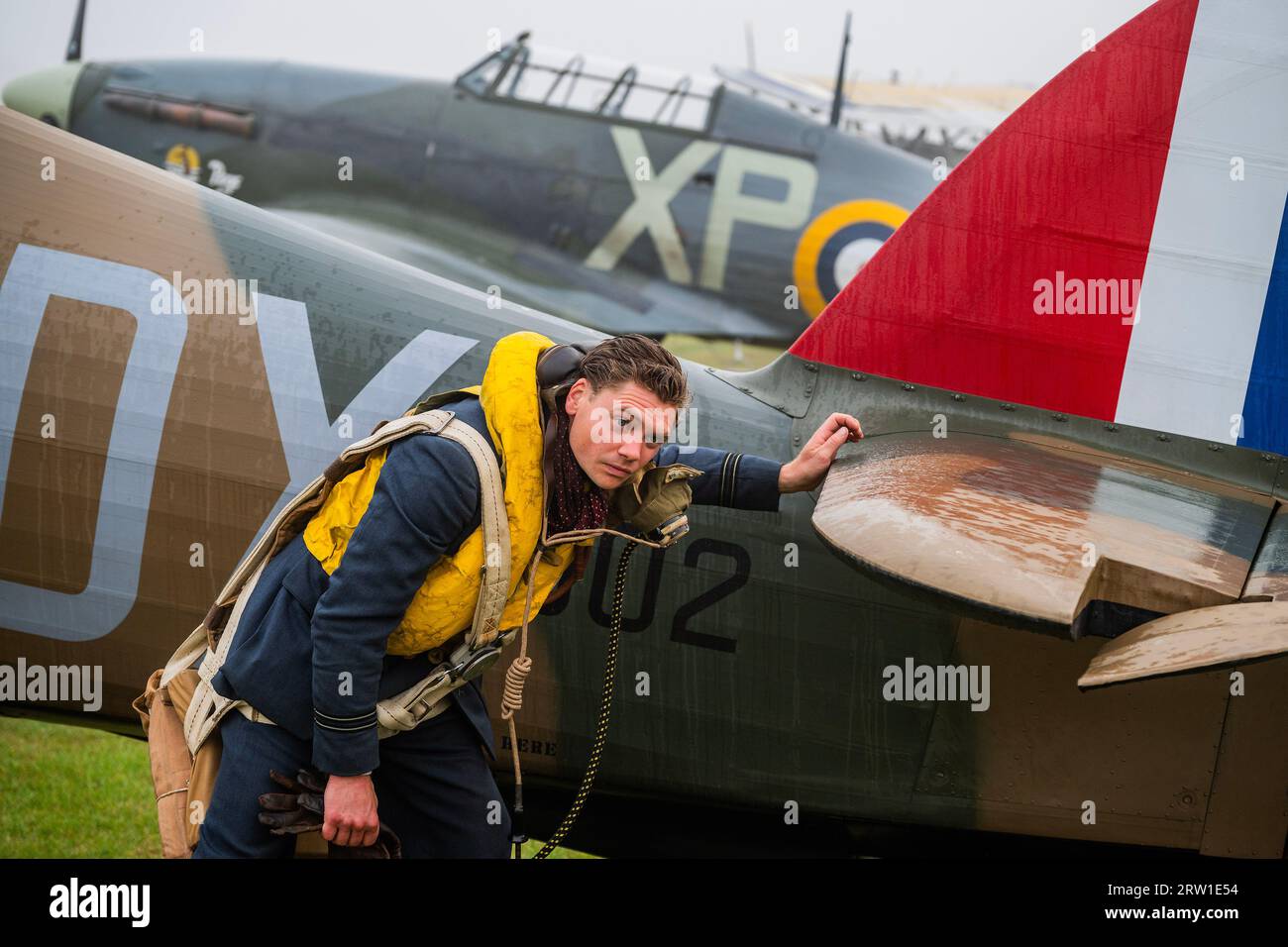 Duxford, UK. 16th Sep, 2023. Spirit of Britain living history re-enactors drive out on the flight line and make final inspections of a Hurricane - The Duxford Battle of Britain Air Show at the Imperial War Museum (IWM) Duxford. Credit: Guy Bell/Alamy Live News Stock Photo