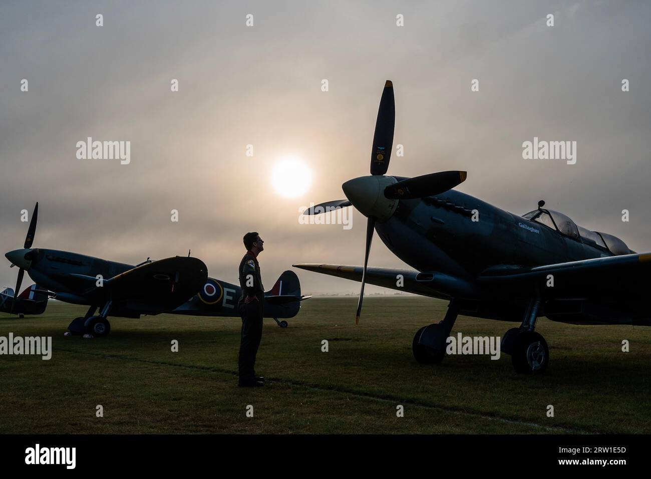 Duxford, UK. 16th Sep, 2023. Spitfires and hurricanes lined up in the dawn light get e pre filght inspection - The Duxford Battle of Britain Air Show at the Imperial War Museum (IWM) Duxford. Credit: Guy Bell/Alamy Live News Stock Photo