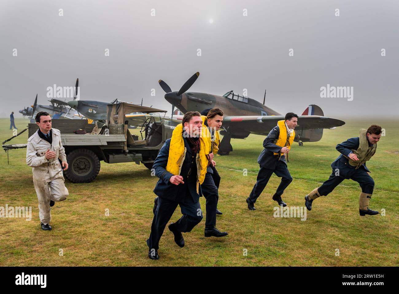 Duxford, UK. 16th Sep, 2023. Spirit of Britain living history re-enactors drive out on the flight line and scramble for their spitfires and hurricanes - The Duxford Battle of Britain Air Show at the Imperial War Museum (IWM) Duxford. Credit: Guy Bell/Alamy Live News Stock Photo
