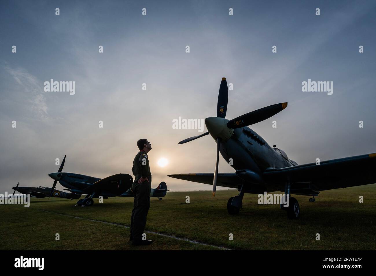 Duxford, UK. 16th Sep, 2023. Spitfires and hurricanes lined up in the dawn light get e pre filght inspection - The Duxford Battle of Britain Air Show at the Imperial War Museum (IWM) Duxford. Credit: Guy Bell/Alamy Live News Stock Photo