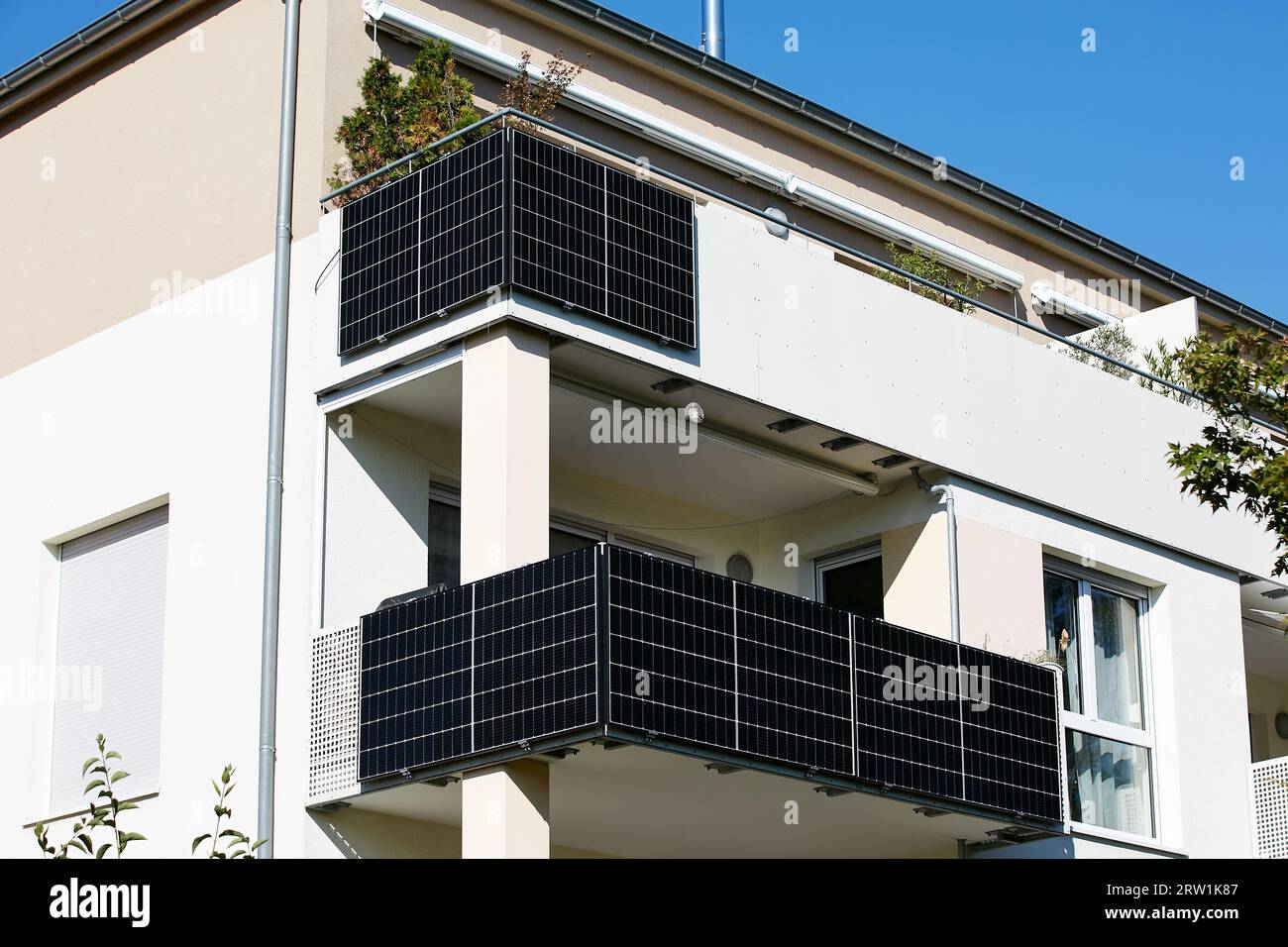 04.09.2023, Germany, Berlin, Berlin - Solar modules for private electricity  generation are mounted on balconies of an apartment building. So-called ba  Stock Photo - Alamy