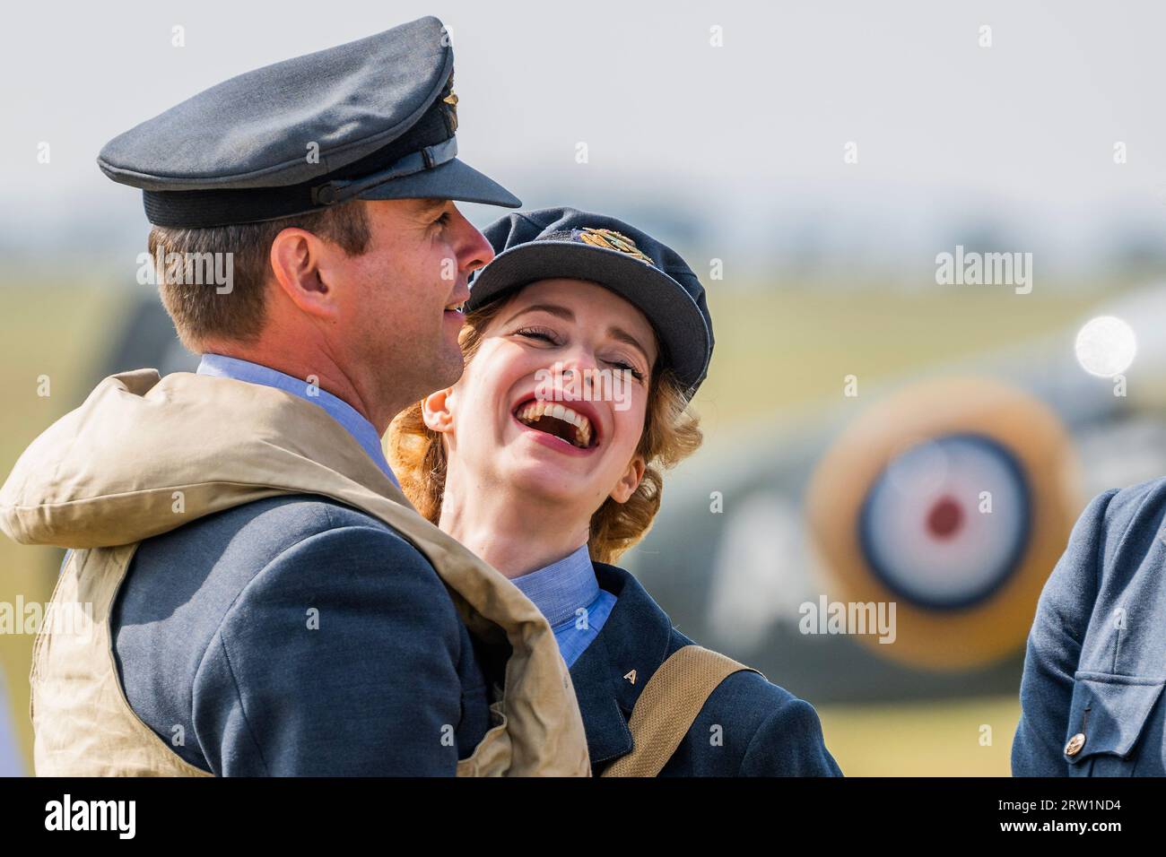 Duxford, UK. 16th Sep, 2023. Living history re-enactors in period RAF uniforms walk the flight line - T Credit: Guy Bell/Alamy Live News Stock Photo