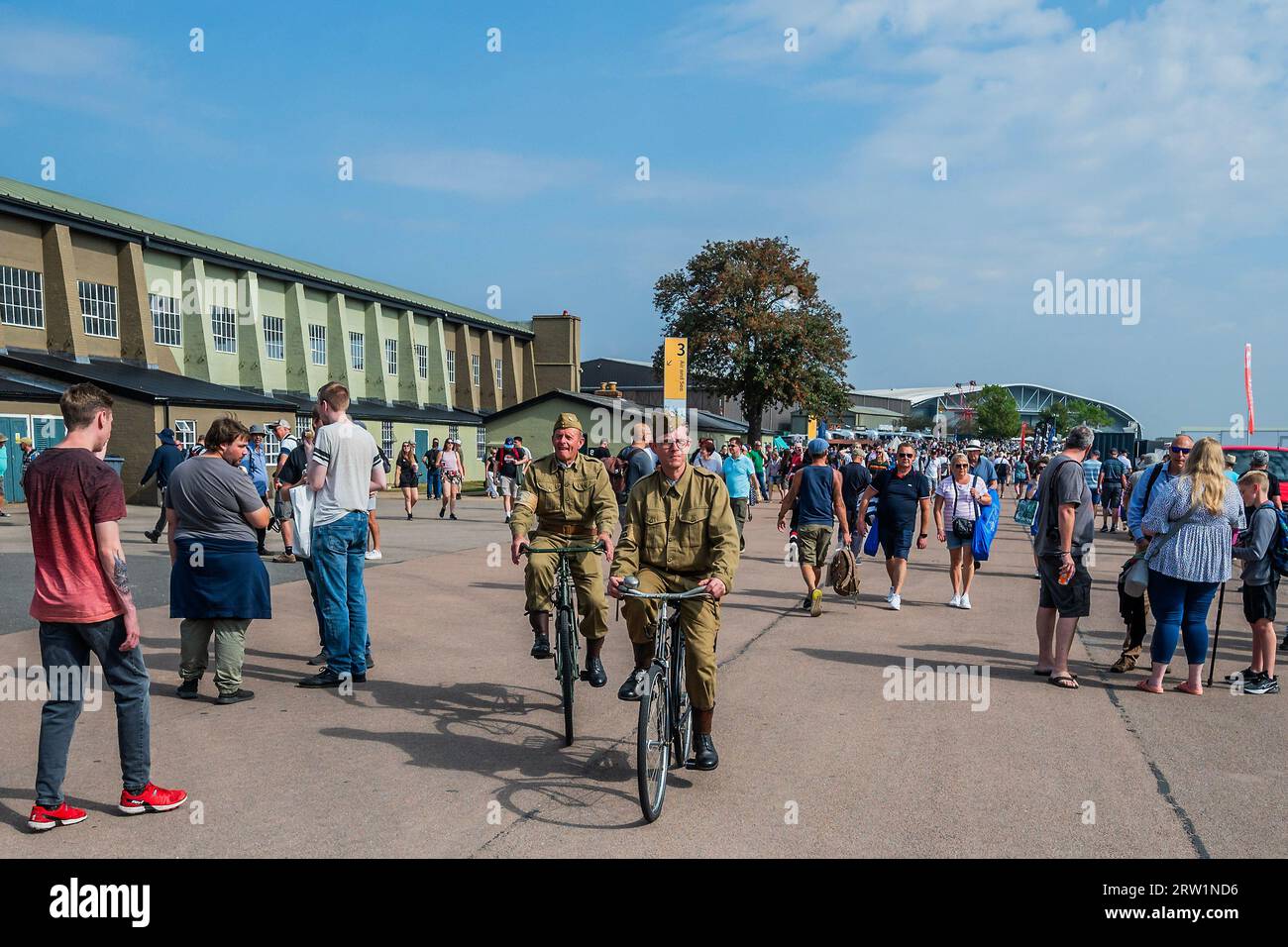 Duxford, UK. 16th Sep, 2023. Home guard cyclists work there way throught the crowd - The Duxford Battle of Britain Air Show at the Imperial War Museum (IWM) Duxford. Credit: Guy Bell/Alamy Live News Stock Photo