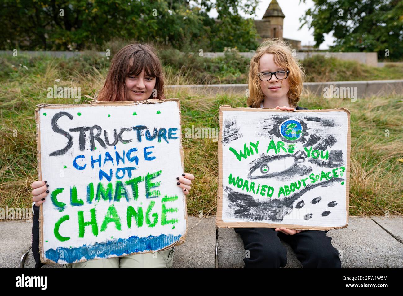 Edinburgh, Scotland, UK. 16th September 2023. Protestors at a demonstration against global climate change organised by Friends of the Earth and Edinburgh Climate Coalition  at the Scottish Parliament in Edinburgh today. A coalition of environmental groups marched from The Mound to Holyrood to protest against the use fossil fuels and against oil and gas companies.  Iain Masterton/Alamy Live News Stock Photo