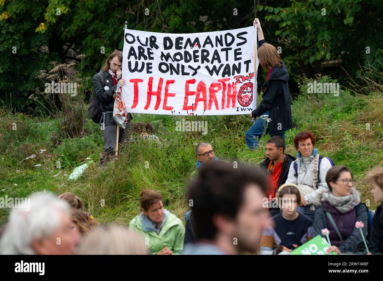 Edinburgh, Scotland, UK. 16th September 2023. Protestors at a demonstration against global climate change organised by Friends of the Earth and Edinburgh Climate Coalition  at the Scottish Parliament in Edinburgh today. A coalition of environmental groups marched from The Mound to Holyrood to protest against the use fossil fuels and against oil and gas companies.  Iain Masterton/Alamy Live News Stock Photo