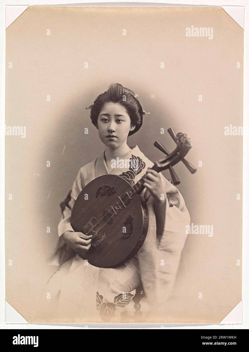 Portrait of a Japanese girl with a musical instrument 1880 Stock Photo