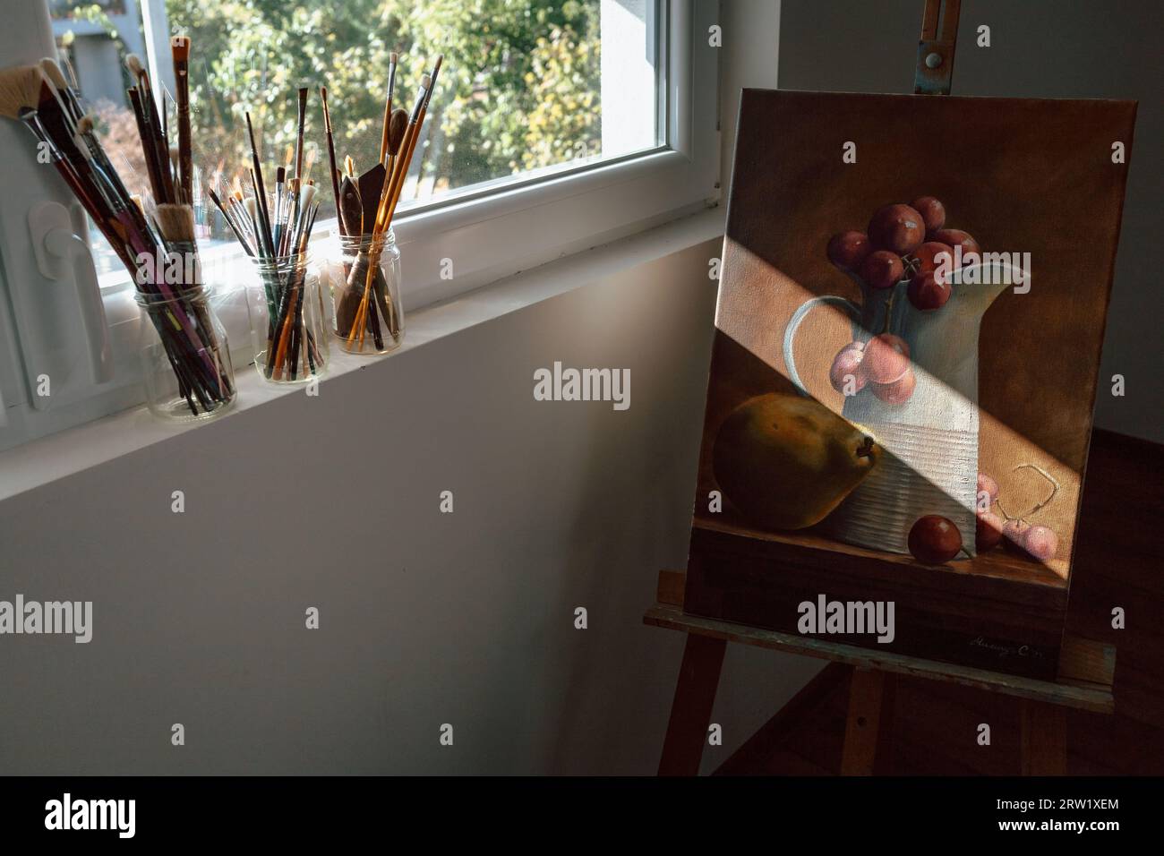 Artwork painting with a brushes on the window Stock Photo