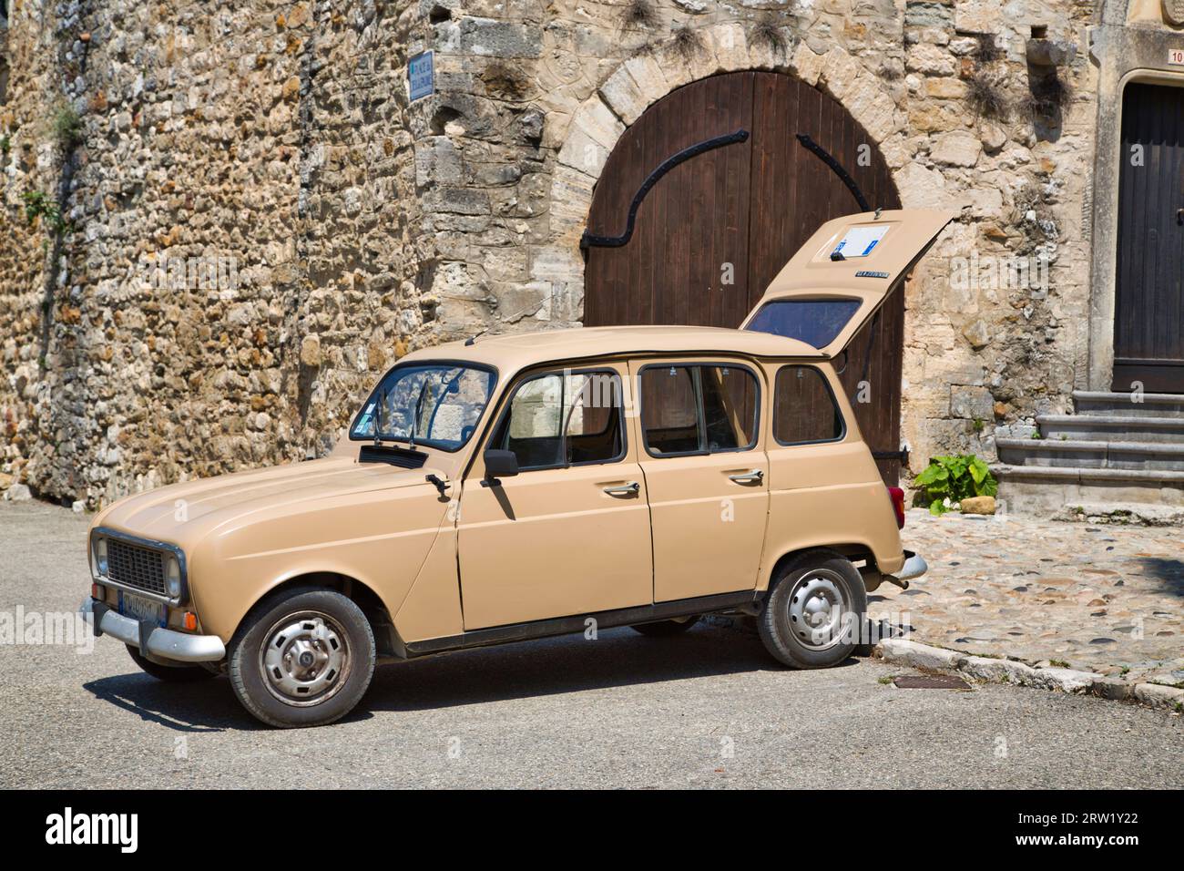 an old french car with open back door Stock Photo