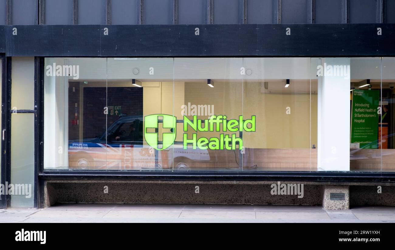 Nuffield Health sign in Nuffield Health Barbican Fitness & Wellbeing Centre building window Beech Street tunnel area London England UK  KATHY DEWITT Stock Photo