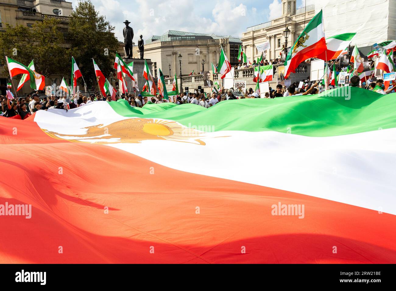 London, UK. 16th Sep, 2023. On the first anniversary of the death of Mahsa Amini, members of the British-Iranian community congregated in Central London to pay tribute. Displayed prominently were images of Mahsa alongside those of Crown Prince Reza Pahlavi and the historic Shir-o-Khorshid flag, an emblem representing Iran. The gathering marked a sombre occasion, honouring not only Mahsa but the broader Iranian diaspora's quest for justice and freedom. Credit: Sinai Noor/Alamy Live News Stock Photo
