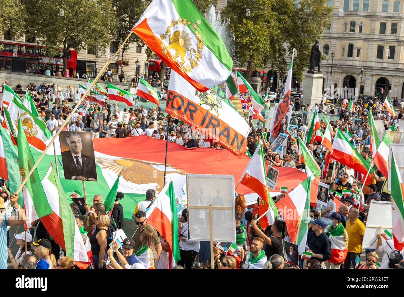 London, UK. 16th Sep, 2023. On the first anniversary of the death of Mahsa Amini, members of the British-Iranian community congregated in Central London to pay tribute. Displayed prominently were images of Mahsa alongside those of Crown Prince Reza Pahlavi and the historic Shir-o-Khorshid flag, an emblem representing Iran. The gathering marked a sombre occasion, honouring not only Mahsa but the broader Iranian diaspora's quest for justice and freedom. Credit: Sinai Noor/Alamy Live News Stock Photo