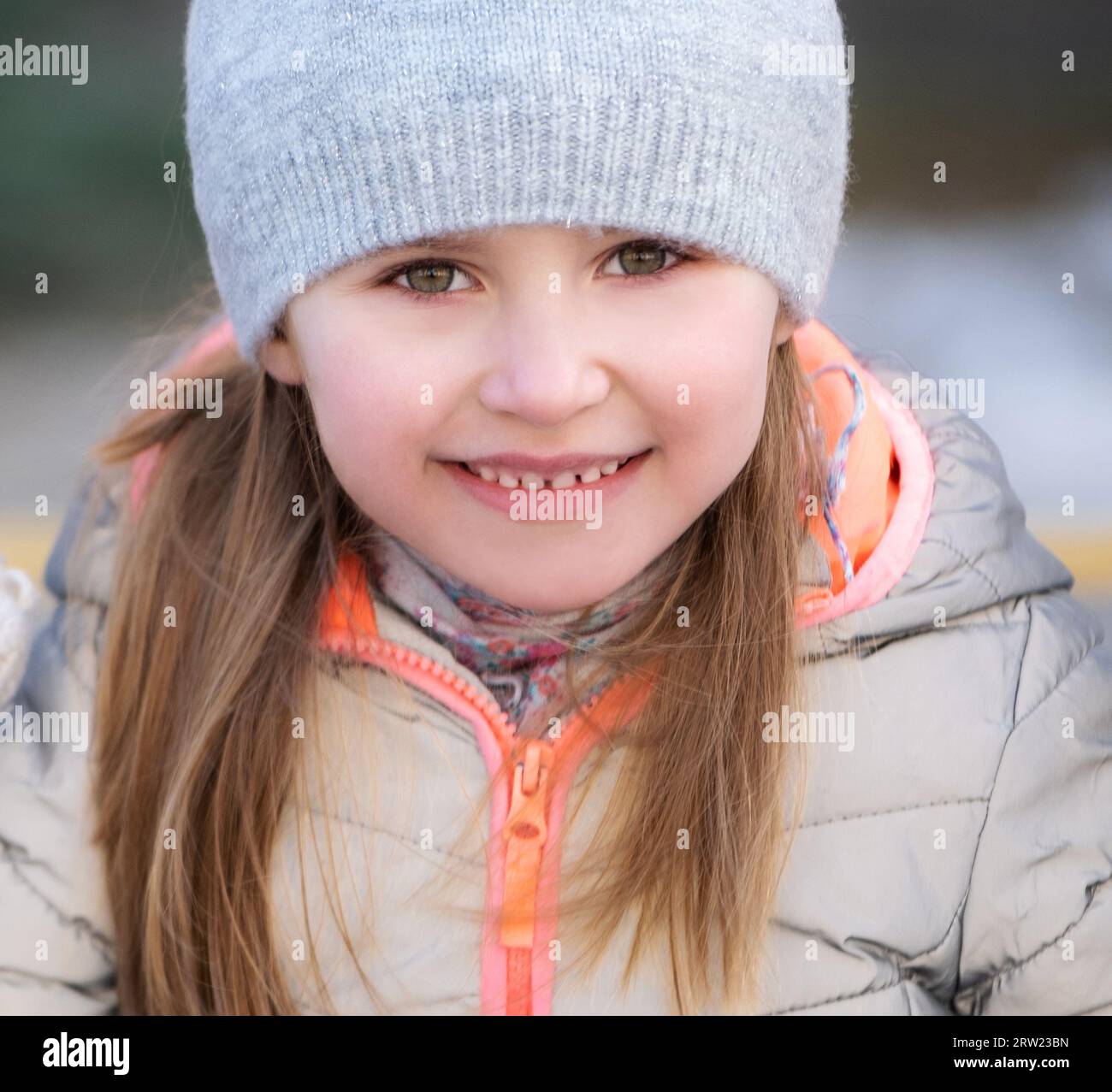 Little cute preteen girl outdoors in winter knitted hat and jacket ...