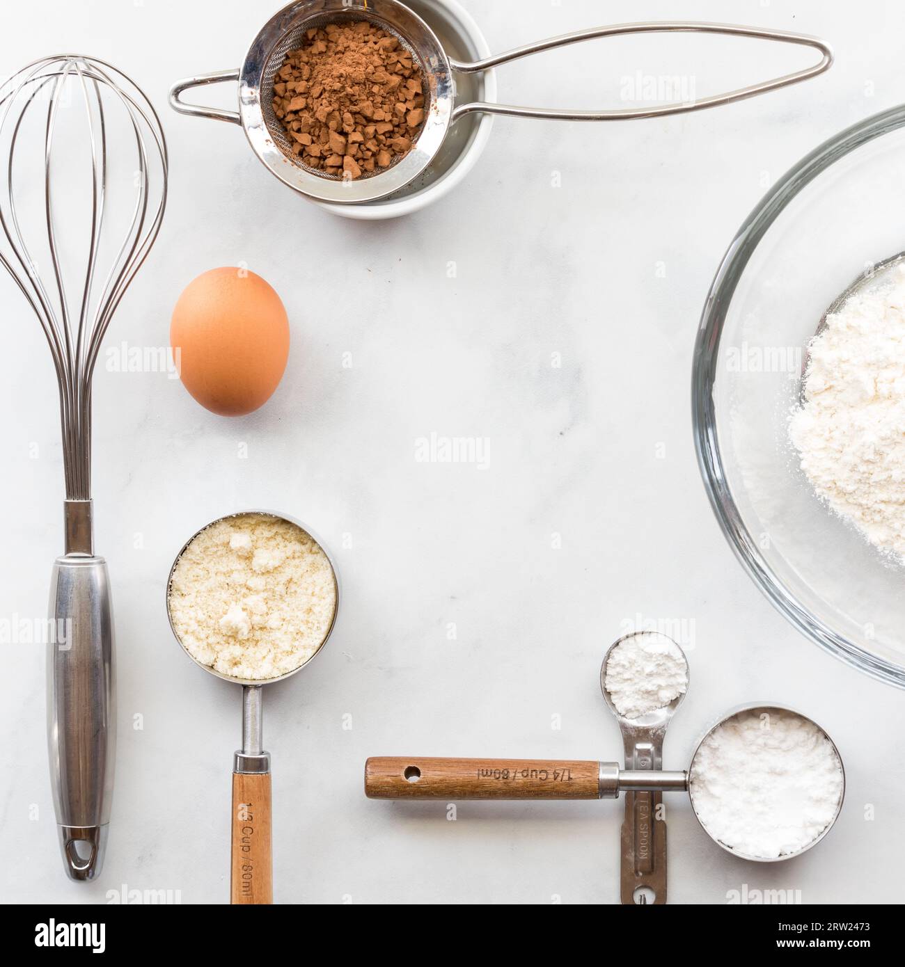 A square border frame of baking utensils and ingredients with copy space. Stock Photo