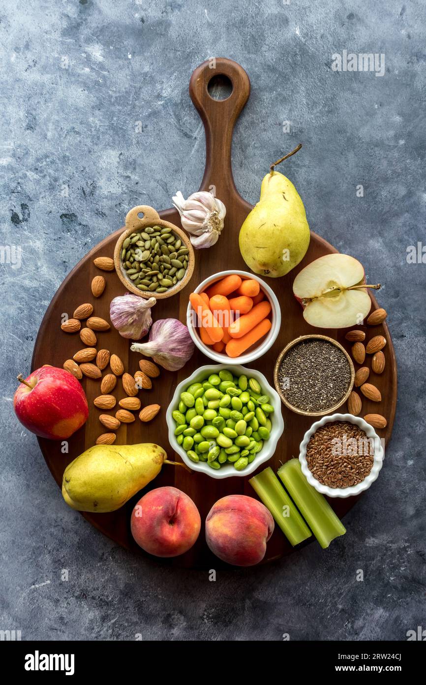 A Top down view of various nutritious plant based foods. Stock Photo
