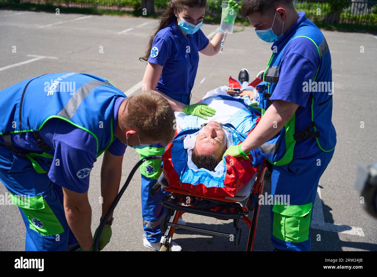 Paramedics use a vacuum mattress to transport patient with polytrauma