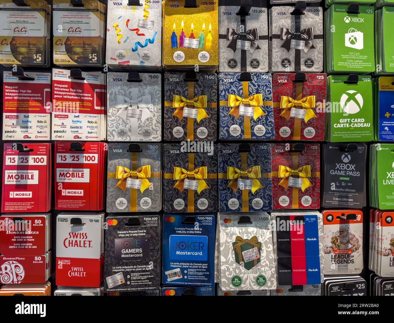 Gift Cards of VISA and MASTERCARDS and other popular brands at a Supermarket Store. Assorted holiday gift cards of various denominations. Stock Photo