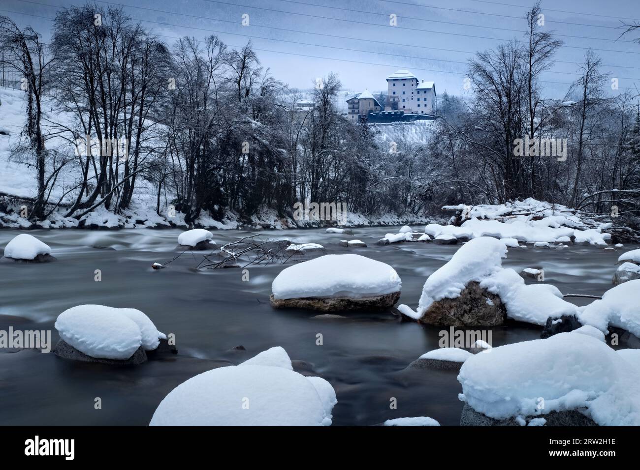 The Noce stream and the medieval castle of Caldes. Sole Valley