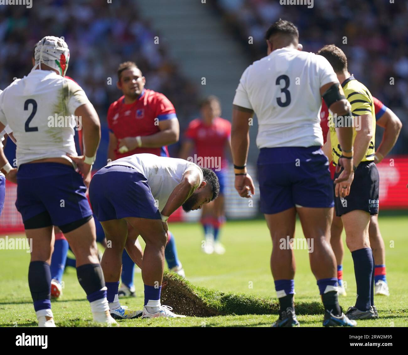 Samoa's Tumua Manu puts back the turf which had come loose during the Rugby World Cup 2023, Pool D match at the Stade de Bordeaux, France. Picture date: Saturday September 16, 2023. Stock Photo