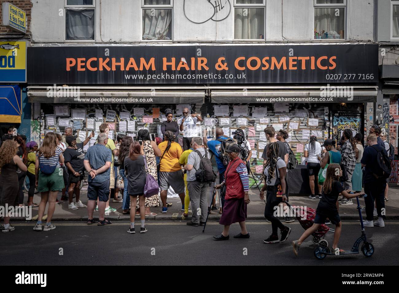 London, UK. 16th September 2023. Protests continue outside Peckham Hair and Cosmetics shop on Rye Lane in east London. The south east London hair and beauty shop has remained closed since Tuesday 12th after a video circulated on social media appears to show a scuffle between a 31-year old black woman and the male owner of Peckham Hair and Cosmetics, Sohail Sindho, 45, who appears to put his hands around her throat during the altercation. Credit: Guy Corbishley/Alamy Live News Stock Photo