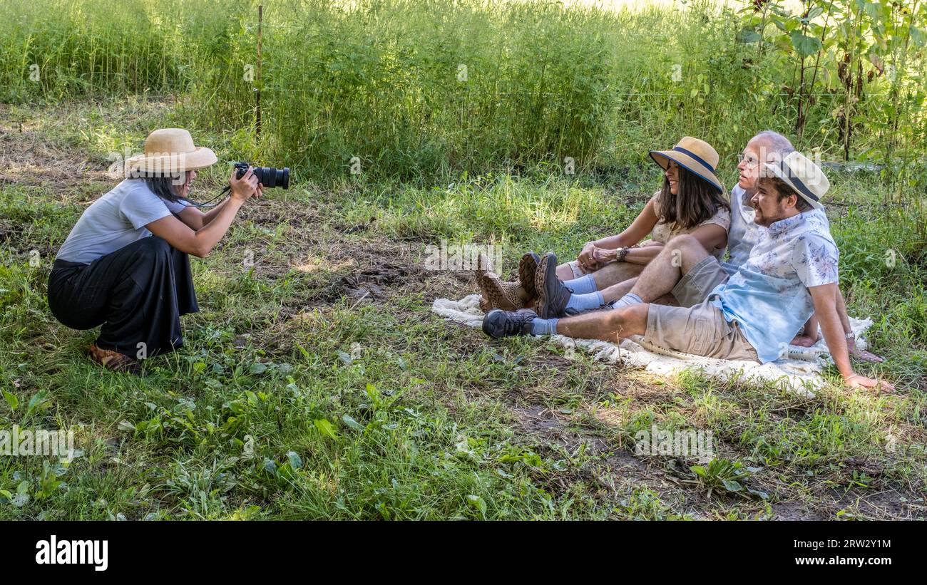 Three people posing for a group portrait Stock Photo