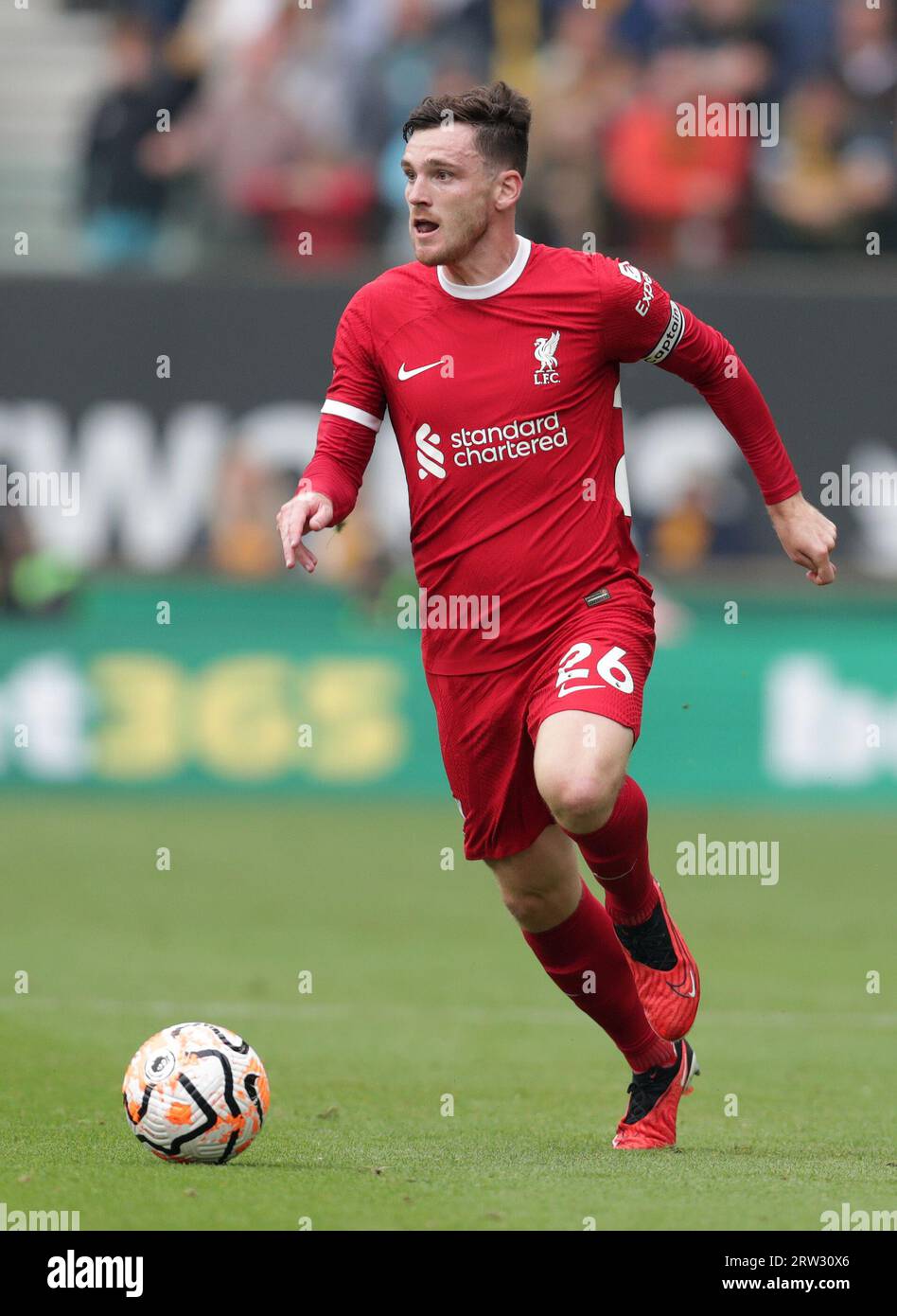 16th September 2023;  Molineux Stadium, Wolverhampton, West Midlands, England; Premier League Football, Wolverhampton Wanderers versus Liverpool; Andy Robertson of Liverpool races forward with the ball Stock Photo