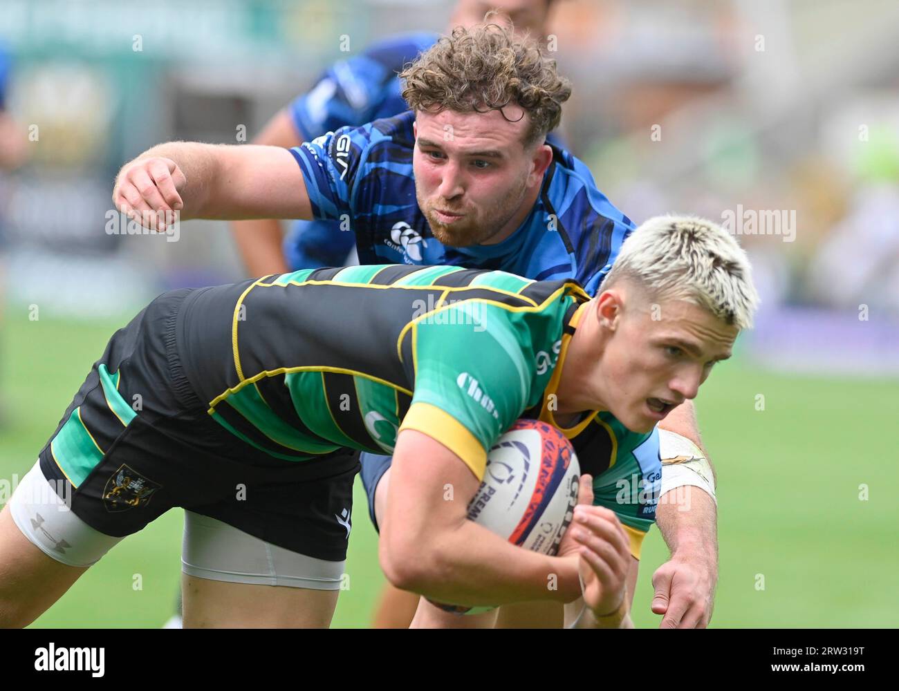 Northampton ENGLAND -  Sept 16 2023 : Archie McParland of Northampton Saints is tackled by Jared Cardew of Cambridge during the  match between  Northampton Saints and  Cambridge Rugby  at cinch Stadium  Franklin’s Gardens.  Northampton Stock Photo