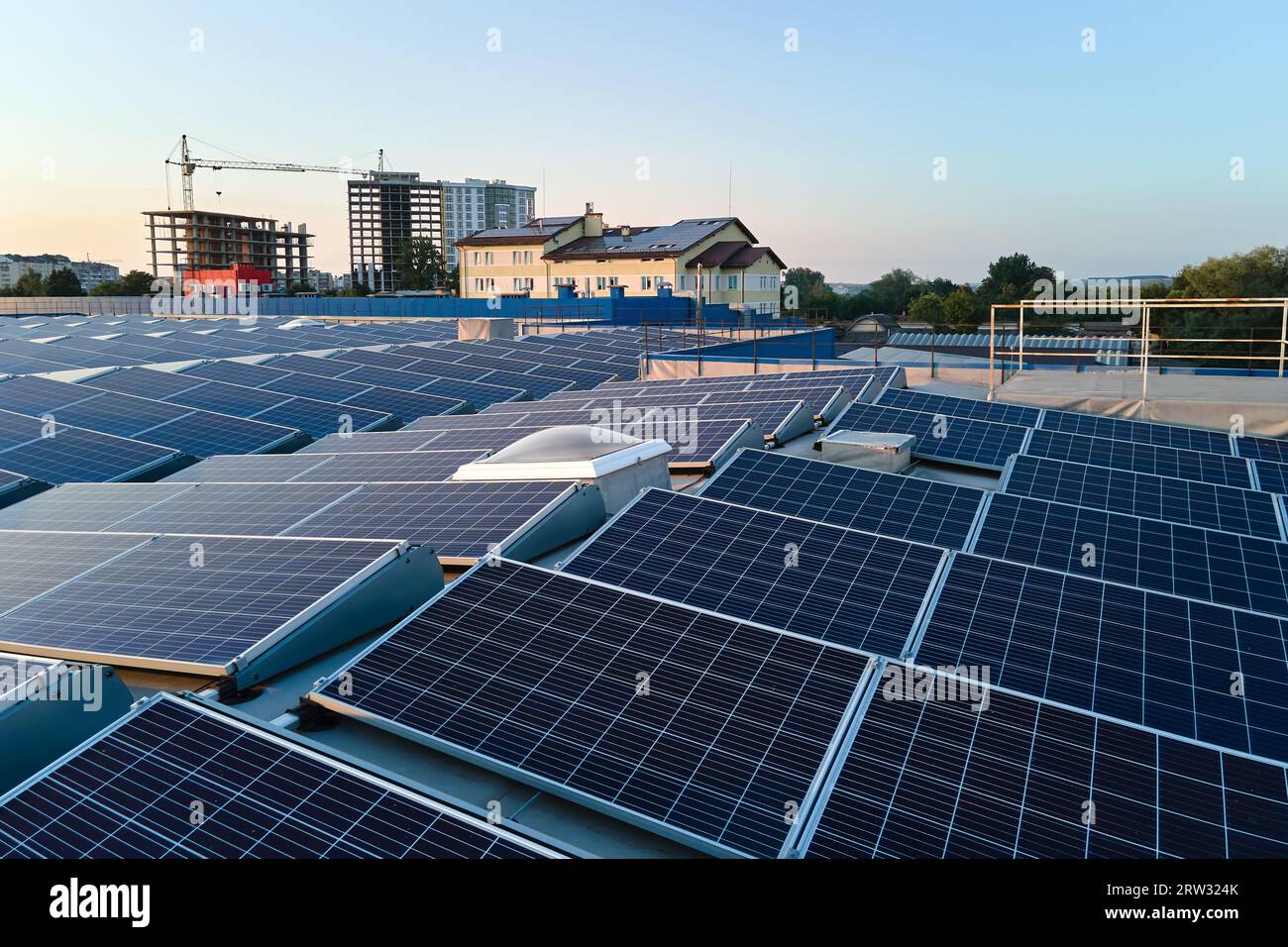 Aerial view of blue photovoltaic solar panels mounted on industrial ...