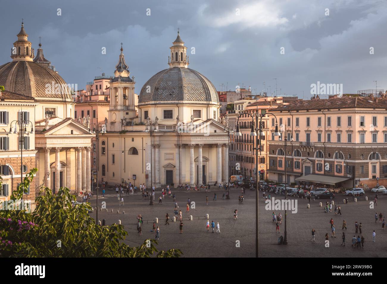 Rome, Italy - August 28, 2023: Moody, atmospheric cityscape view over Baroque churches in the popular tourist landmark Piazza del Popolo in the histor Stock Photo