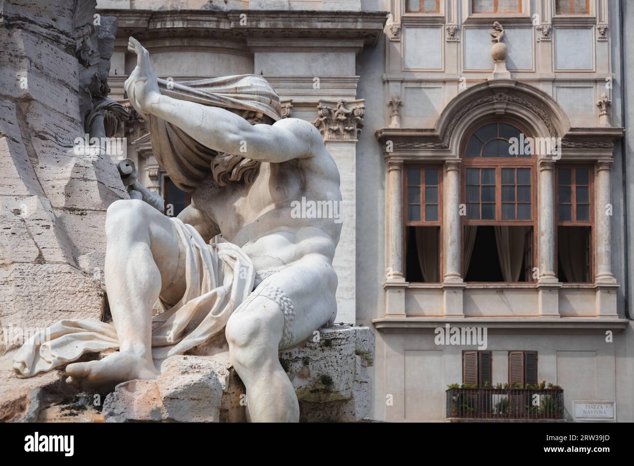Close-up detail of biblical figure in Bernini's sculpted Baroque Fountain of the Four Rivers in Piazza Navona, a popular tourist landmark in the histo Stock Photo