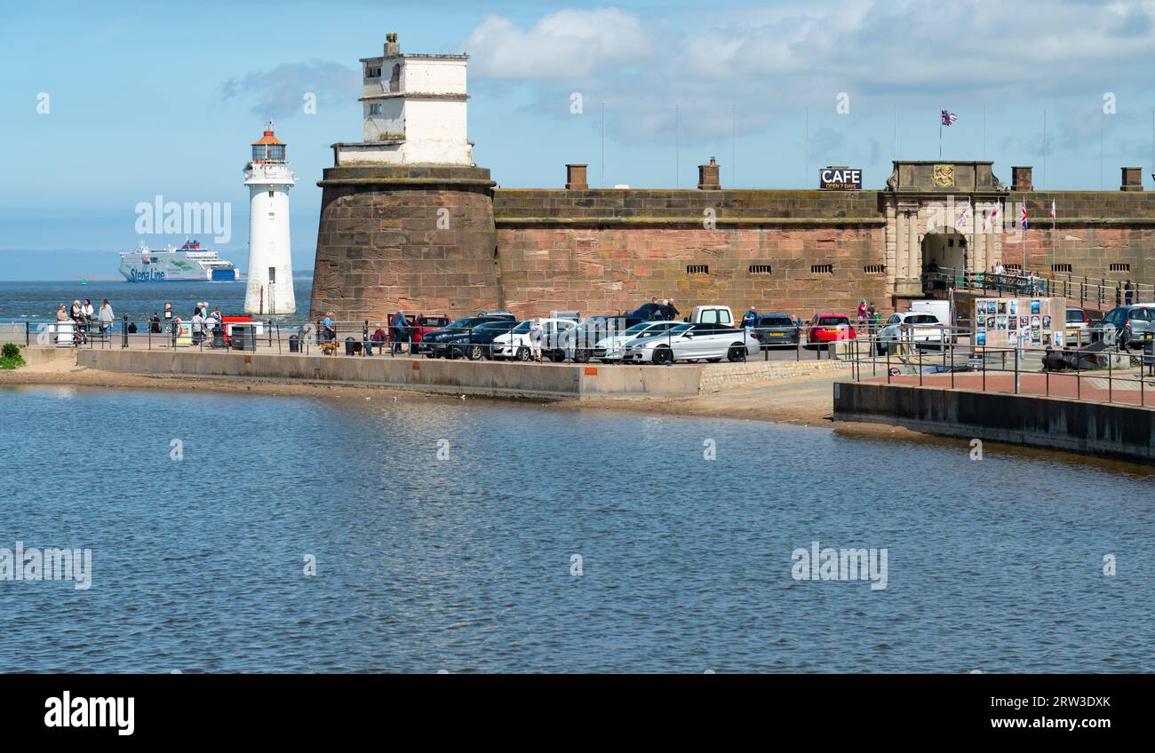 Fort Perch Rock, New Brighton Lighthouse and Birkenhead to Belfast Ferry at the mouth of the River Mersey, in May 2023. Stock Photo