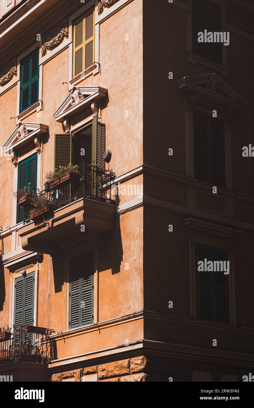 Dramatic light and shadow over colourful residential buildings and architecture in the charming neighbourhood of Trastevere the old town of historic R Stock Photo