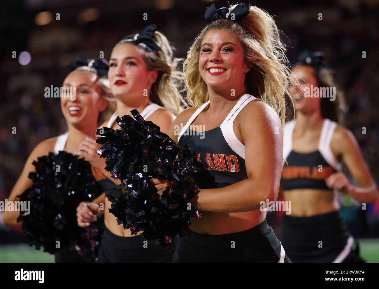 COLLEGE PARK, MARYLAND, USA - 15 SEPTEMBER : Maryland cheerleaders cross the field after a touchdown during a college football game between the Maryland Terrapins and the Virginia Cavaliers on September 15, 2023, at SECU Stadium in College Park, Maryland. (Photo by Tony Quinn-Alamy Live News) Stock Photo